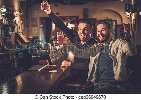 Picture of Cheerful old friends having fun watching a football.