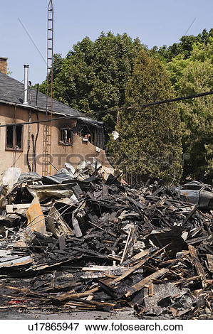 Picture of Fire damaged Cottage style Residential Home next to the.