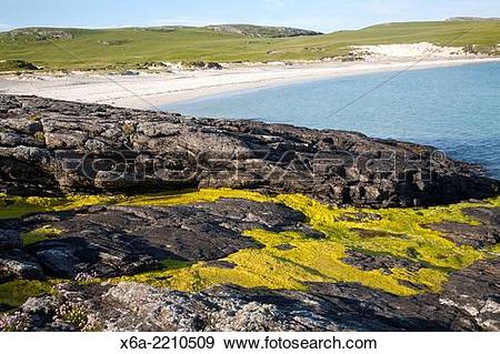 Stock Photograph of Rocky headland and sandy beach at Bagh a Deas.