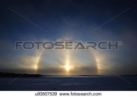 Stock Photograph of "A Sundog, Parhelia or Mock Sun, is created by.