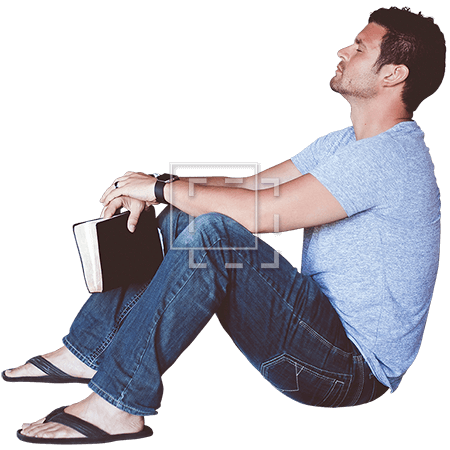 Man Sitting with Book Leaning Against Wall.