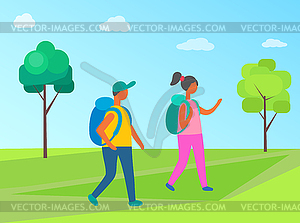 Couple Man and Woman with Backpacks Walk Forest.