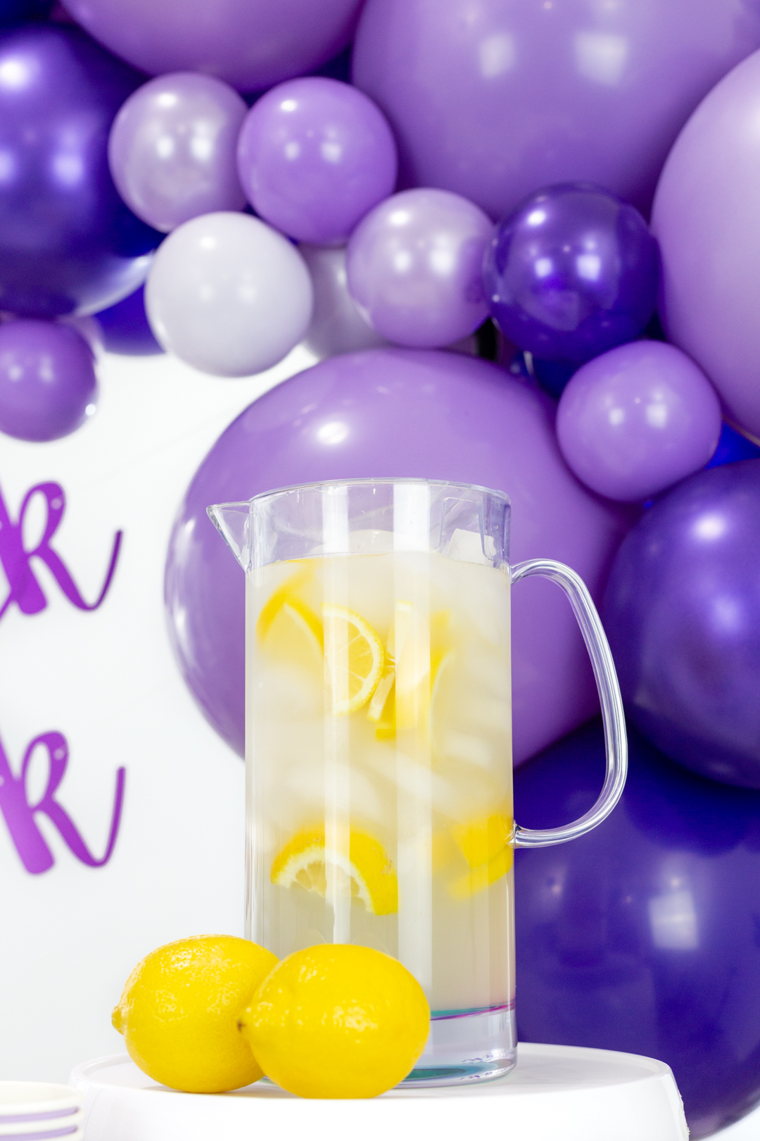 pitcher of lemonade with fresh lemon slices