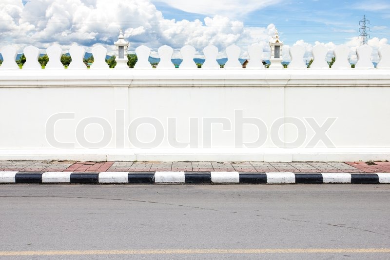 Road side and white big wall and Thailand country view in background |  Stock image | Colourbox