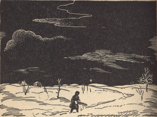 man walking through the snow at night