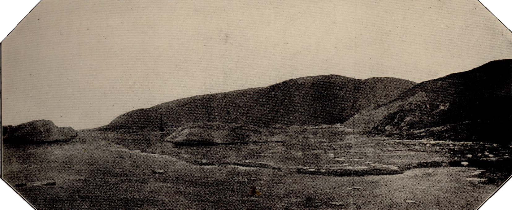 Summer landscape with rolling hills and rocks or ice around bay, sailing ship farther out in bay.