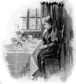 woman sitting at a well-laden table