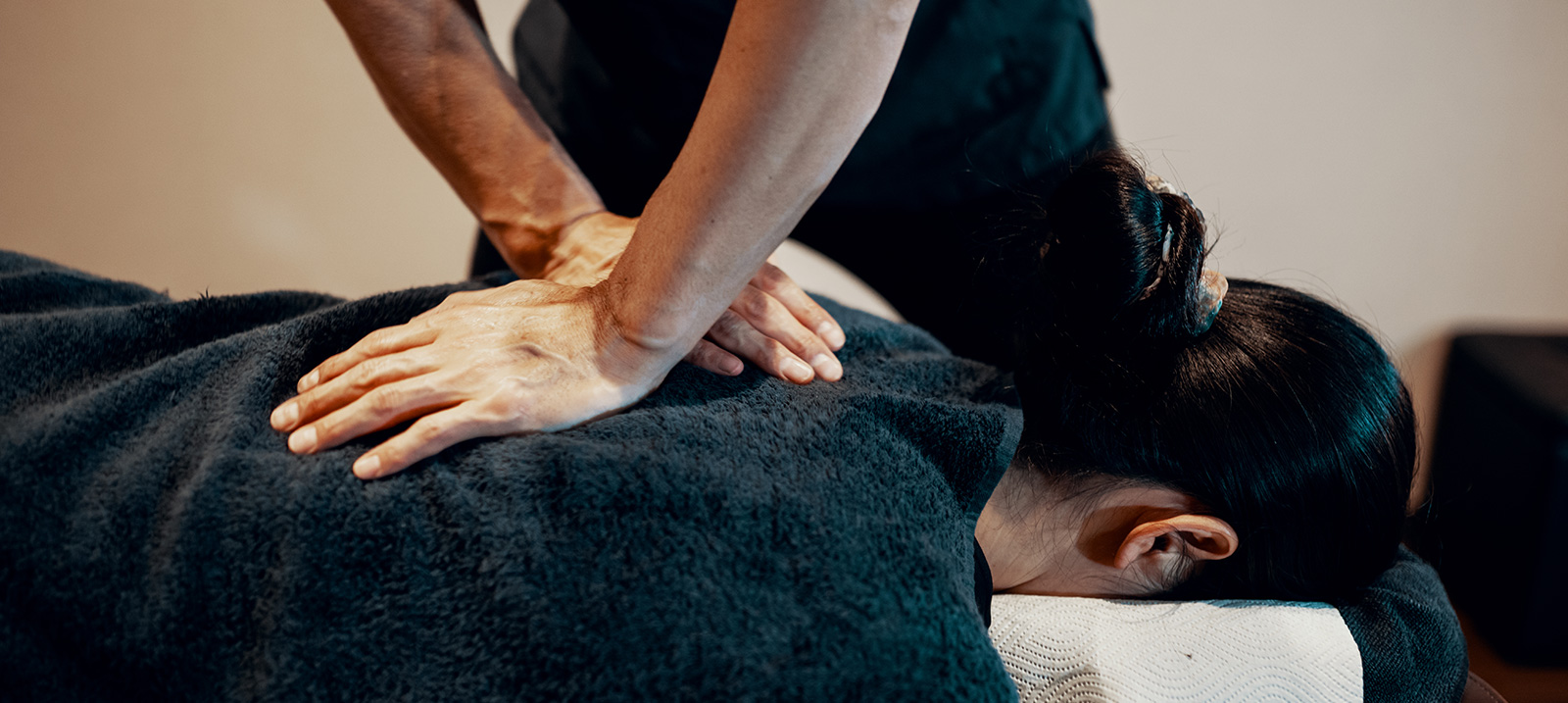 chiropractor adjusting a patient's back