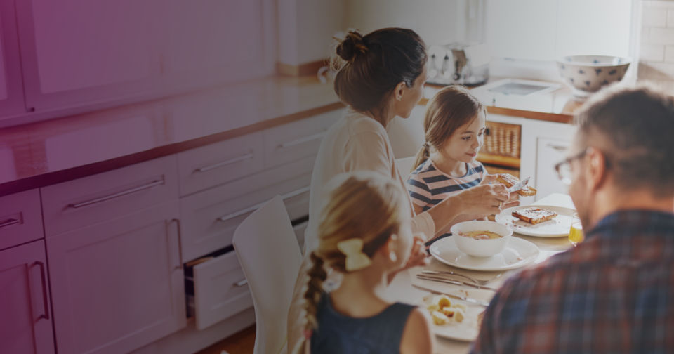 Family sitting at a kitchen table