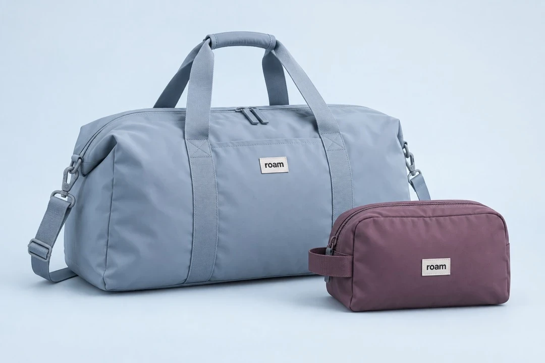 Blue-grey roam weekend duffel and plum toiletry pouch