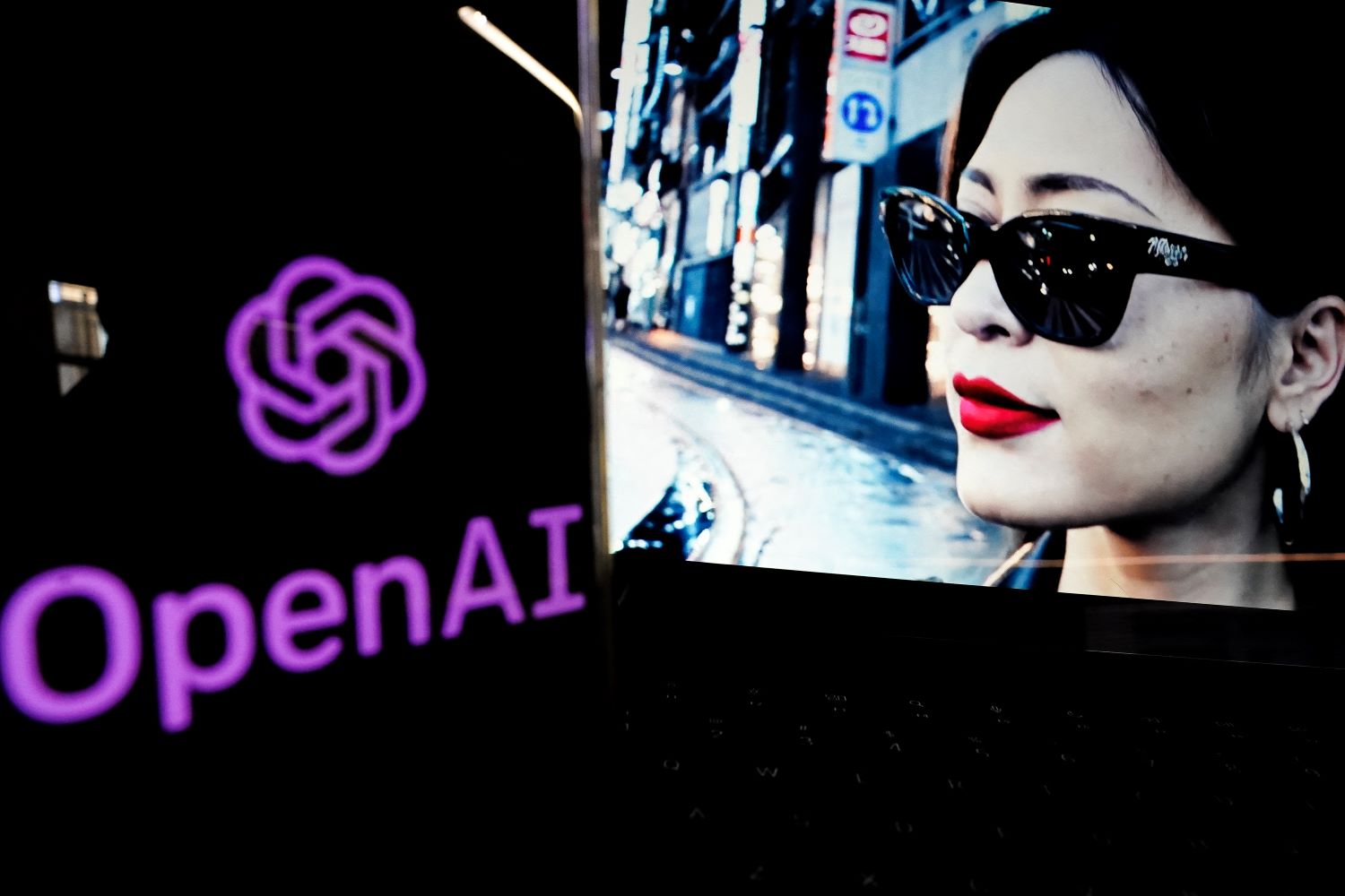 The OpenAI logo next to a picture of a woman wearing sunglasses, which was generated by the company's Sora AI model.