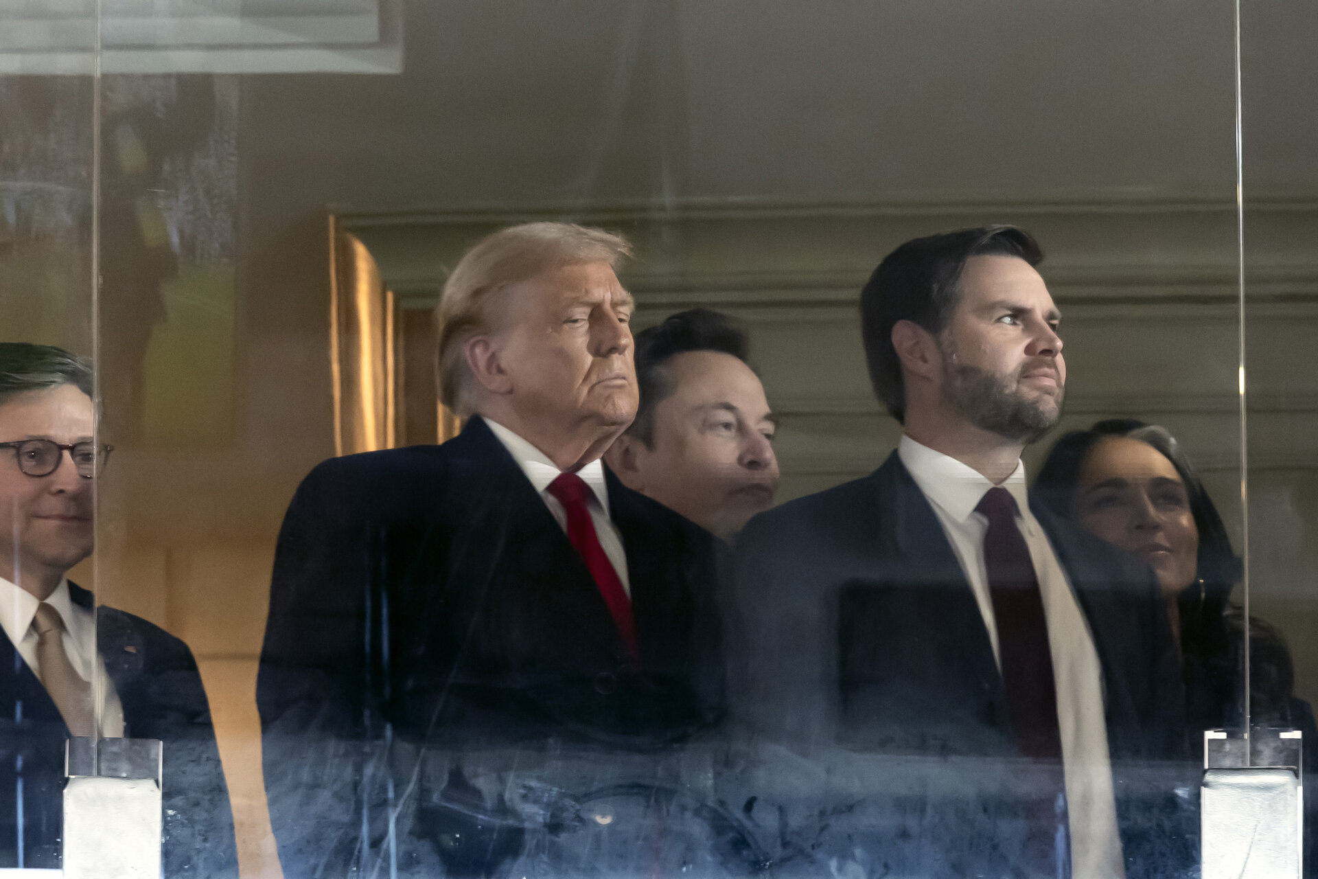 LANDOVER, MARYLAND - DECEMBER 14: (L-R) U.S. Speaker of the House Mike Johnson (R-LA), President-elect Donald Trump, Tesla CEO Elon Musk, Vice President-elect JD Vance and Trump's nominee to be Director of National Intelligence former U.S. Rep. Tulsi Gabbard from Hawaii attend the 125th Army-Navy football game at Northwest Stadium on December 14, 2024 in Landover, Maryland. Trump is attending the game with lawmakers and Cabinet nominees including, Vice President-elect JD Vance, Speaker of the House Mike Johnson (R-LA), Defense Secretary nominee Pete Hegseth, incoming Senate Majority Leader John Thune (R-SD) and others.