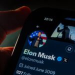 Picture of Elon Musk's X account displayed on an iPhone.