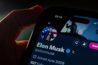 Picture of Elon Musk's X account displayed on an iPhone.