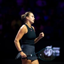 Aryna Sabalenka reacts while playing against Qinwen Zheng