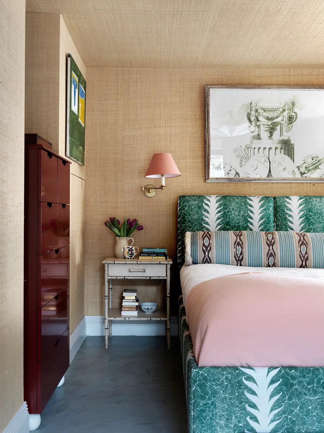 A second bedroom with the same beige wallpaper as the entry