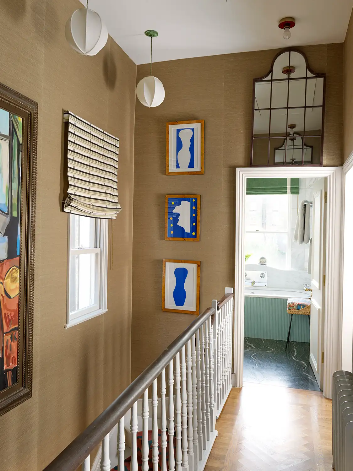 Eclectic entryway with beige wallpaper