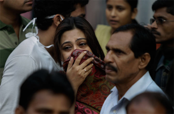 A woman cries after a fire broke out at a nursing home in Kolkata, India, Friday, Dec. 9, 2011.- AP Photo