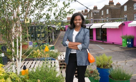 tashia tucker standing surrounded by plants at the box park in shepherds bush market