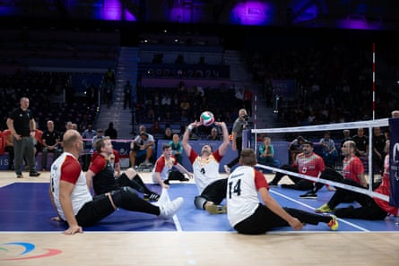 Heiko Wiesenthal volleys during a sitting volleyball match 