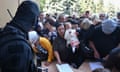 Russian evacuees line up to fill out forms at a humanitarian aid distribution centre in Kursk, Russia. 