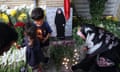 Flowers are laid and candles lit in front of the Lebanese embassy in Tehran on 18 September 2024.