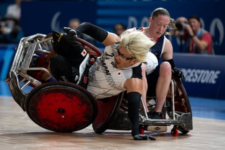 Yuki Hasegawa topples over during a wheelchair rugby game