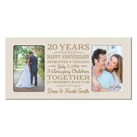 Honor the happy couple with a personalized 20th wedding anniversary photo frame. A treasured and lasting personal keepsake for a wedding or anniversary. The 20th Anniversary picture frame can be hung on a wall or displayed on a table. This special keepsake anniversary gift will always be a wonderful reminder of the love that you have for one another. Honor the happy couple with a 20th wedding anniversary decorative wood photo frame that holds 2- 4x6 photos. Words are laser engraved. Wooden frame