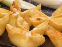 MMMMMmmmm Baked Crab Rangoon... 1/8 tsp garlic salt, 1/8 tsp Worcestershire sauce, 14 won ton wrappers, 1 small green onion, 4 oz imitation crab, 3 oz cream cheese... Bake at 425 °F for 8-10 minutes or until golden brown.