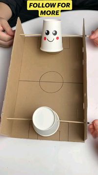 Difficulty: Easy     Materials Needed:  • cardboard box  • 2 Cups  • a ping-pong ball  • 2 chopsticks