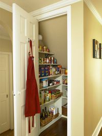 Establish an Efficient Pantry. Convert the space under the staircase into a small room for storing food, paper goods, and extra cooking equipment. Add a door and wrap the three walls with shallow shelves.