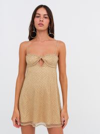 A Highly Coveted FL&L style, the bestselling Glitter gold slip dress enchants all year round. Coated in rhinestone embellishments, this embellished mini dress spotlights keyhole cutout accents.