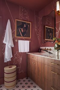 Designer Naika Andre of @njainteriors brought a long-standing vision to life with her bold, red-themed hall bathroom for the 2024 Kingston Design House. Inspired by a red tile image she’d admired on Pinterest for years, she used Tile America’s for the shower and their Black and White Flower mosaic for the floor. Adding warmth and elegance, Andre paired the striking hues with our Monterey Pull and the Florence Solid Brass Knob, both in burnished brass.  Photography by Phil Mansfield