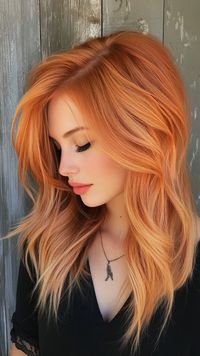 Embrace a soft and delicate touch with peachy copper waves that flow effortlessly. Discover more gentle and stylish hair ideas on our website. Don’t forget to save this pin for your next hair transformation!