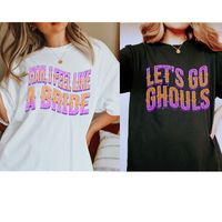 Saddle up for a spook-tacular time with our Comfort Colors Halloween Bachelorette Shirts! These country-inspired tees are the perfect fit for your bridal posse. With a touch of neon and a retro vibe, our matching Country Bach Party Tees ensure both style and comfort. "Let's Go Ghouls, Let's Party" in true cowboy-like fashion. Crafted from Comfort Colors shirts, they provide the perfect oversized look. Wrangle up the Halloween spirit and ride into a memorable bash with these uniquely designed, co