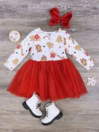 - Ready to Ship - We Ship from Ohio Elevate the holiday spirit with our 'Ginger & Spice' Girls Holiday Chiffon Tutu Dress. This delightful dress features a white top adorned with a charming gingerbread cookie design. The attached red sparkle tulle skirt adds a touch of magic to your little one's festive look. It's the perfect outfit to celebrate the season in style and comfort. Pick up this seasonal outfit while your little's size is still in stock and be sure to checkout our other new fall arri