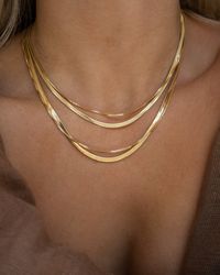 "This thin herringbone gold chain is what layering necklaces is all about. Made in 14k gold filled, this chain will not tarnish. This bold gold chain will pair nicely with daintier chains, long and short, or make a statement all on its own. Dimensions 3\" thickness and 16\" or 18'' length. Materials 14k gold filled *Hypoallergenic *Nickel free *Tarnish resistant *Water resistant *Handmade in USA Notes ~ Soft jewelry pouch included. ~ Limit contact with water for longer durability and prevent tar