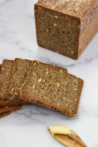 An easy and foolproof recipe for traditional Danish rye bread known as rugbrød. Made with instant yeast (NO sourdough starter required), rye flour, whole grains and a variety of wholesome seeds, this dense rye bread is as nutritious as it is delicious. Perfect for smørrebrød, the famous Nordic open sandwiches served in Denmark!