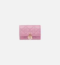 The My Dior Glycine wallet is distinguished by its compact and practical design. Crafted in hydrangea pink Cannage lambskin, it is enhanced by D.I.O.R. charms on the front. Accommodating all the essentials, the refined accessory will fit anywhere and can be paired with other My Dior creations..