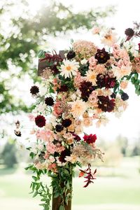 Burgundy wedding arbor. Dahlia wedding arbor. Fall wedding arch.