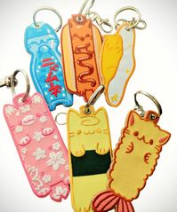 Embroidered Keychain - Jet Tag - Embroidered on both sides - 3cm Keyring w/ bonus lobster clasp - each design roughly 10cm long Choose between the following designs: Ta-meow-go Tem-purr-a Sakura Nya-mune lol SunnySide Hot Cat Discounted bundle also available for all 6 designs.  :3 Great for use on key rings and on zipper pulls to decorate backpacks, keys, luggage, etc. Add a pop of color and cuteness to find your keys or differentiate your bags/luggage. Please take into your consideration that m