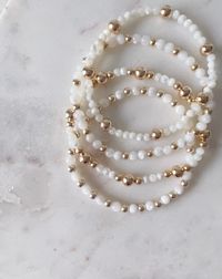 These beautiful Mother of Pearl bracelets with gold-filled spacer beads make for the perfect addition to any bracelet stack. They also would be a stunning addition to a bridal shower or for your bridesmaids. Each one is uniquely different and made with high quality material