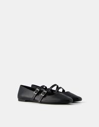 Buckled ballerinas. Available in black. 