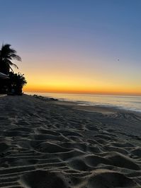 The sun setting on the beach in Cabo San Lucas, Mexico.