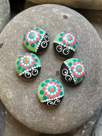 "Set of 5 Hand Painted Ladybug Gems. Each glass gems have been hand painted with a one off unique pattern.  The prices listed are for the 5 painted gems. Optional magnets can be added to the back of each gem as an extra cost. Indoor use only. The gems are approximately 17mm (3/4\") in diameter. Other Ladybug designs as well as mandala gems are also available in my shop. I use high quality acrylic paints and then finish each gem off with a clear gloss acrylic top coat, giving great UV protection.  All my stones/gems come with a colourful gift bag as standard.  They are perfect to add a splash of colour in the home and are ideal as a unique gift. All my products are painted with love, care and attention and are carefully packaged to make sure they reach you in perfect condition and are sent