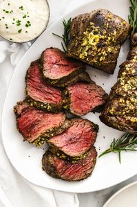 This beef tenderloin roast gives your average steak an easy upscale lift! It’s seared with a garlic herb crust, roasted to tender perfection, and served with a creamy horseradish sauce.