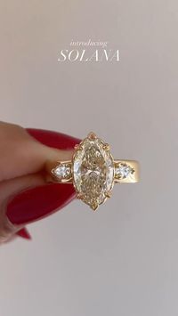 Solana radiates love and romance through her captivating champagne diamond, embraced by a floral basket and leaf-engraved prongs. Accompanying her marquise heart are two pear cut diamonds on either side - all set atop a bold, yet graceful, 4.5mm band.