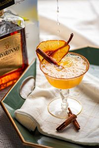 Shake up a spiced pear martini to celebrate Autumn! Cinnamon and cardamom combine with pear vodka and amaretto in this delicious fall cocktail