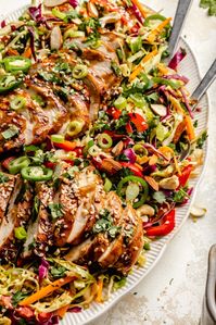 Fresh and delicious sesame chicken salad packed with bright, crunchy vegetables, juicy chicken, and a flavorful sesame ginger dressing. This flavorful sesame chicken salad is easy to customize with your fav veggies and proteins for the perfect healthy lunch or dinner during the week! #salad #chicken #healthylunch #healthydinner #sesamechicken #mealprep