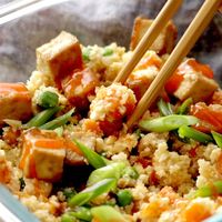 Cauliflower Fried Rice! Healthy + clean fried rice made with cauliflower, carrots, onions, garlic, eggs, sesame oil and THE BEST baked crispy tofu. Vegetarian / gluten free. #cauliflower #friedrice #mealprep #vegetarian | pinchofyum.com